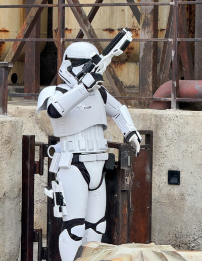 stormtrooper-disneyland-galaxys edge - Mini Travel Adventures 4 Us Stormtrooper at Galaxy’s Edge in Disneyland posing with blaster raised.
