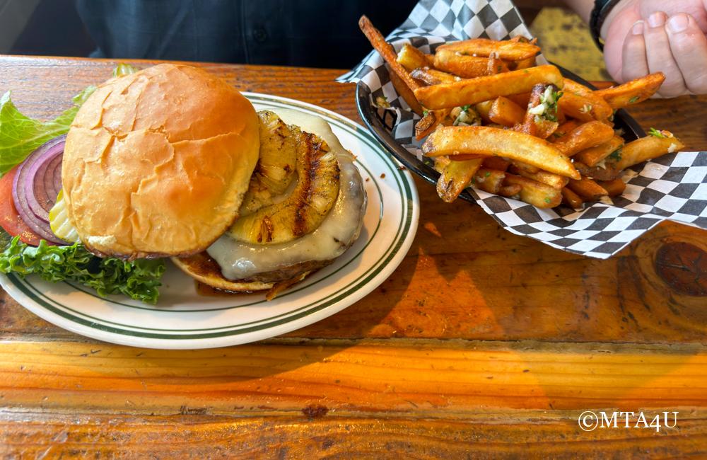 Smokey's Hawaiian burger with grilled pineapple, teriyaki sauce, and a juicy beef patty.