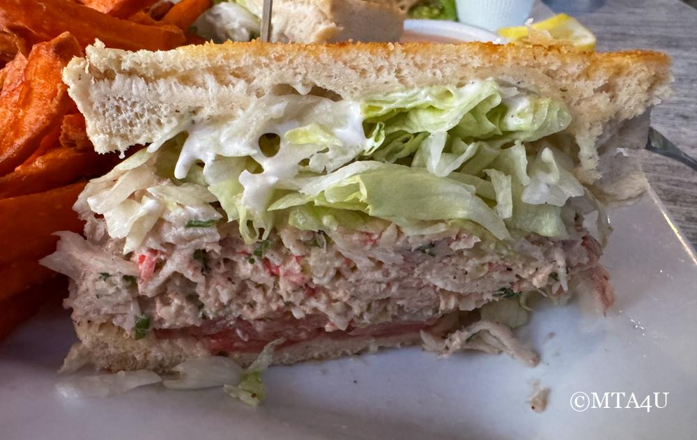 A close-up of a seafood sandwich served at Moonstone Bar and Grill in Cambria, California.