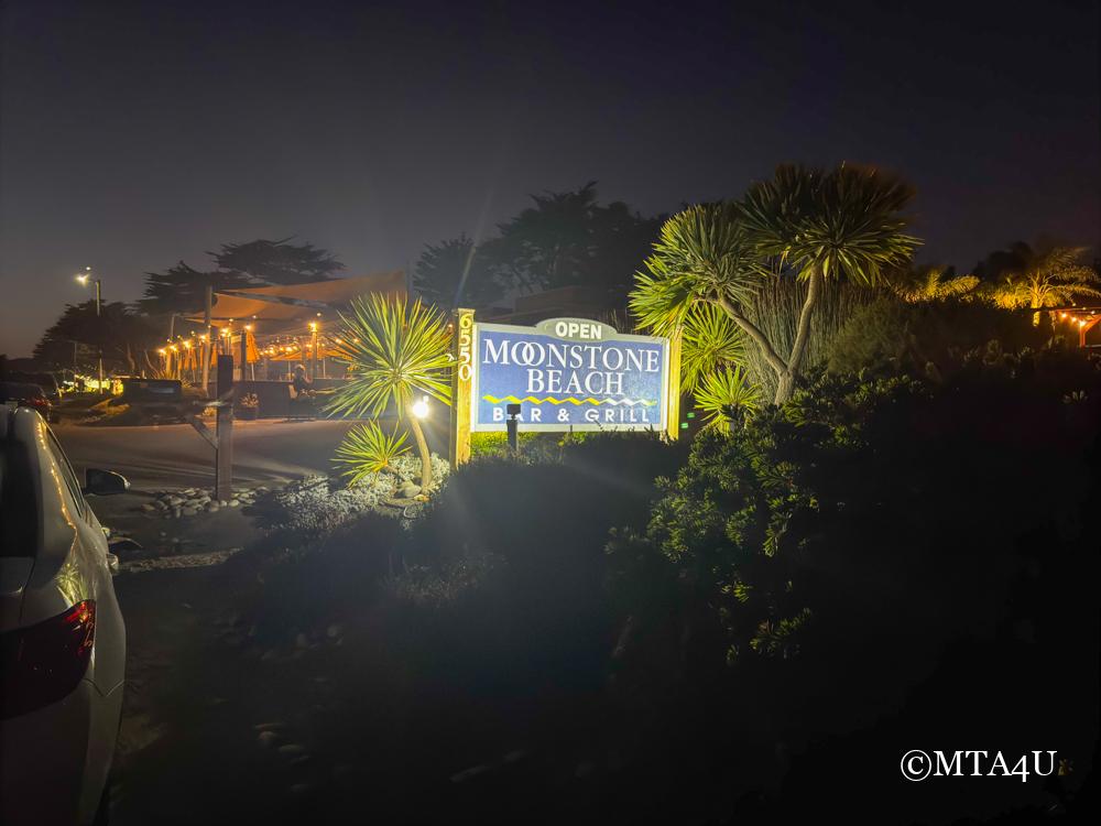 A sign at night, illuminated at Moonstone Beach Bar and Grill, Cambria, California.