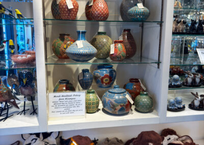 Handcrafted pottery from Nicaragua and animal-themed hats on display at Etc.Etc.Etc. shop in Cambria, California.