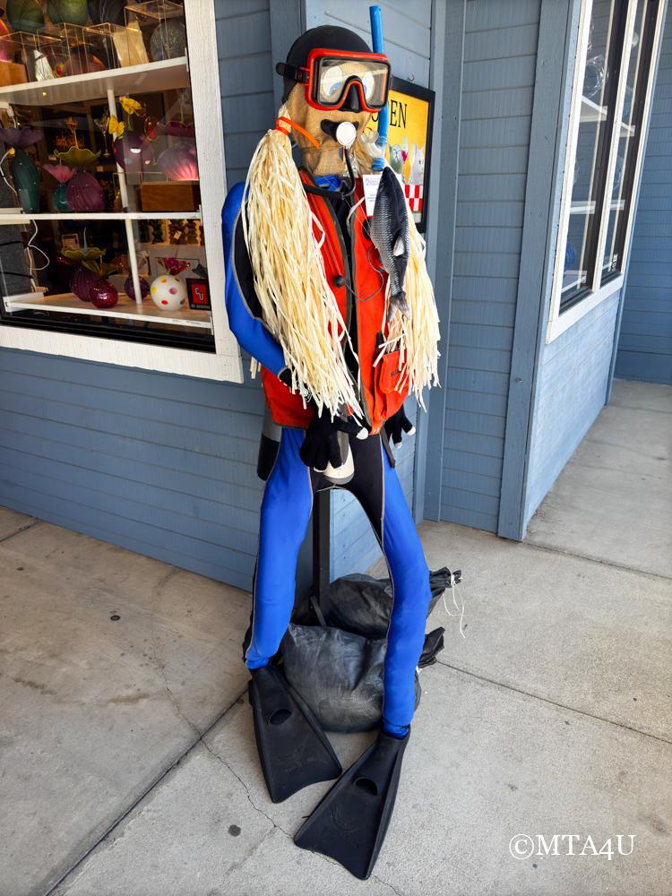 Creative scarecrow displays at the Cambria Scarecrow Festival. 