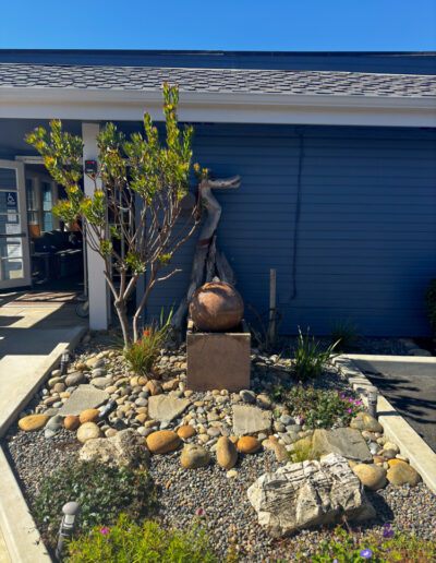 Outdoor decor and sculpture water fountain at Sand Pebbles Inn in Cambria, California.