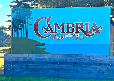 Cambria, CA Welcome Sign with Scenic Background