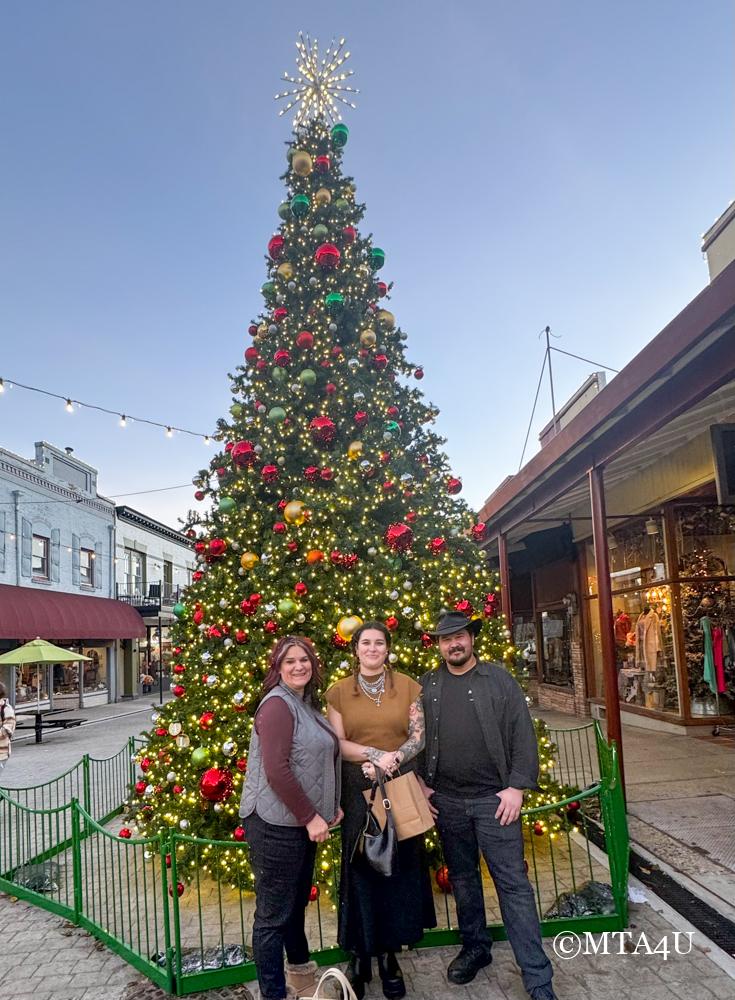 Standing in front of a Christmas tree in downtown Grass Valley on Mill Street.