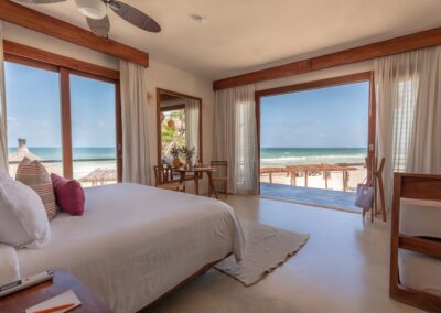 Oceanfront suite at a couples resort in Tulum with beach access and open-air dining.
