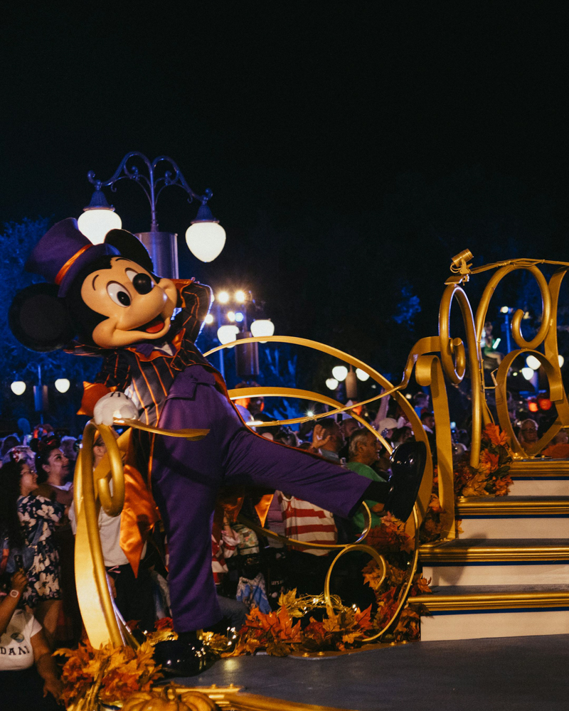 Mickey Mouse Halloween Parade Float at Magic Kingdom Mickey Mouse waving from a Halloween-themed parade float during Mickey’s Not-So-Scary Halloween Party at Walt Disney World.