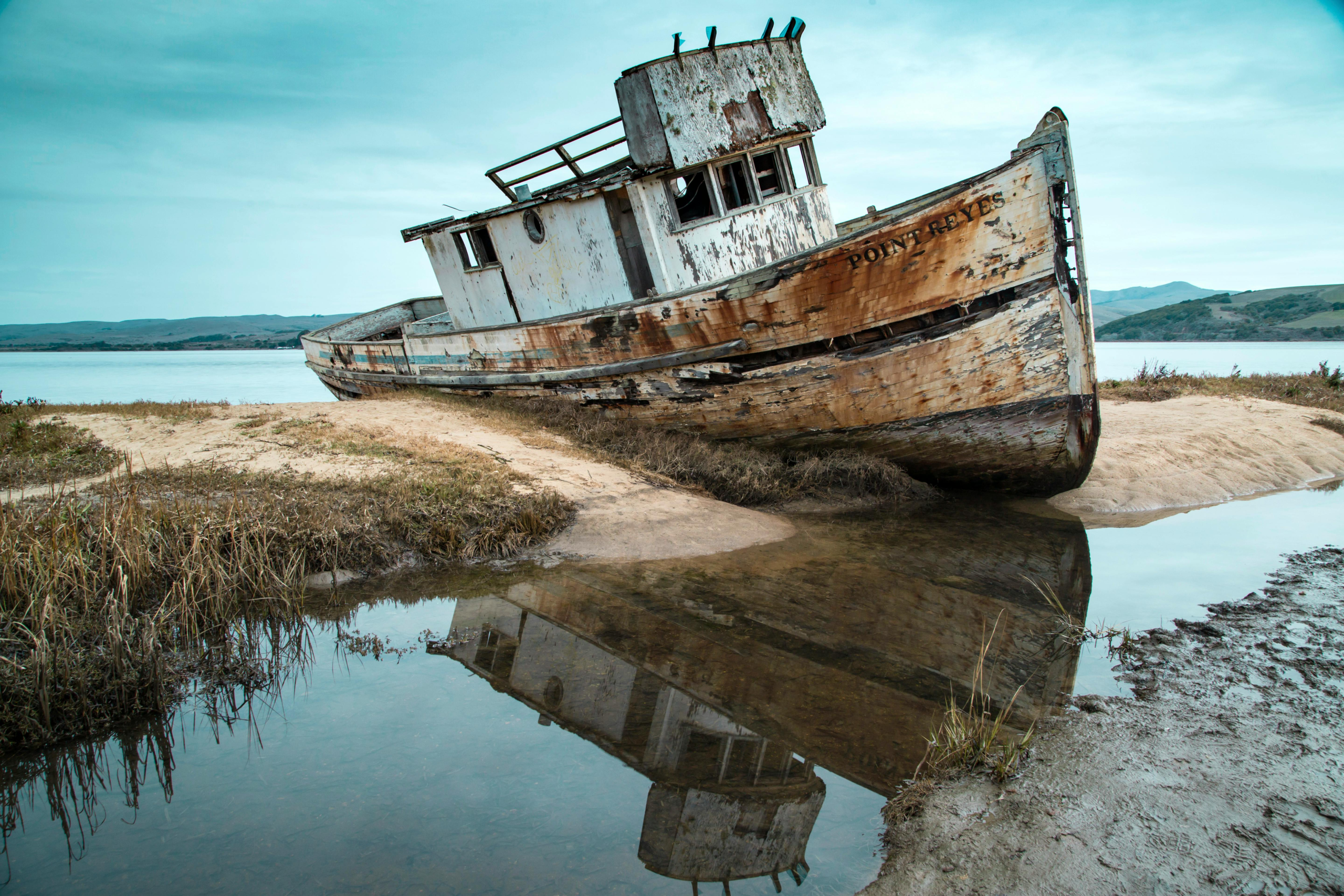 Weathered Inverness Shipwreck on the shoreline of Point Reyes National Seashore, a must-see stop on a Point Reyes day trip itinerary.