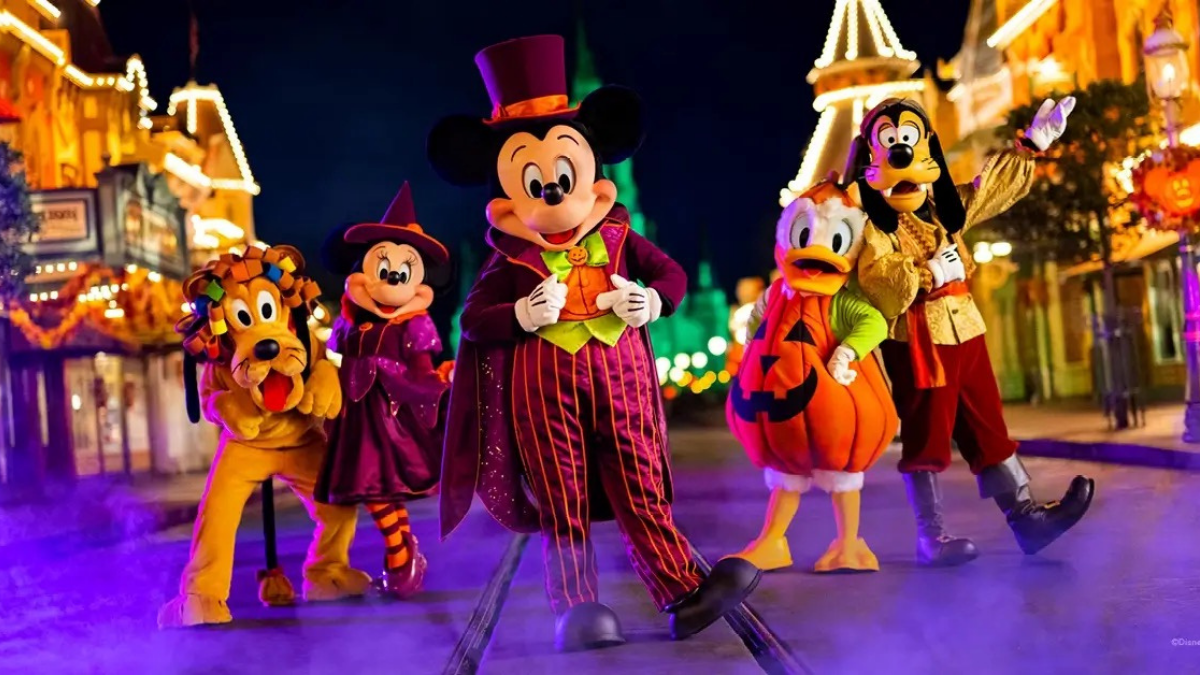 Disney characters walking on Main Street during Mickey’s Not-So-Scary Halloween Party at Magic Kingdom.