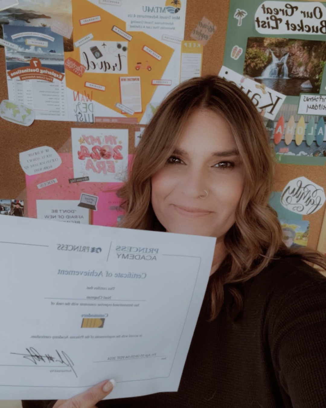 Noel Chapman holding her Princess Academy Certificate of Achievement in 2025 during her continuing education as a travel advisor.