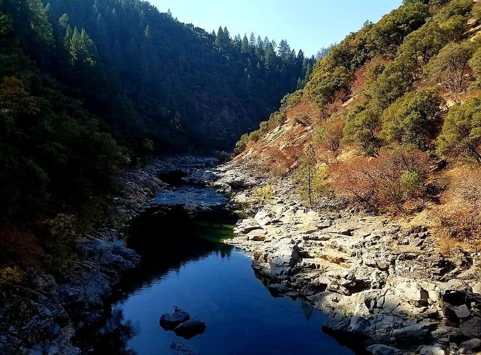 Emerald green water and granite boulders at one of the best Yuba River swimming holes near Nevada City, California