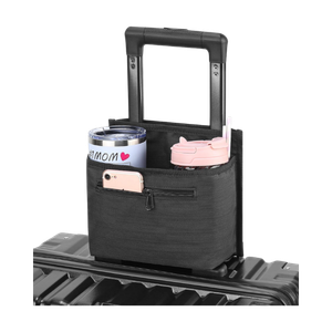 Black luggage travel cup holder attachment with drink pockets and zippered phone pocket attached to a suitcase handle<br />
