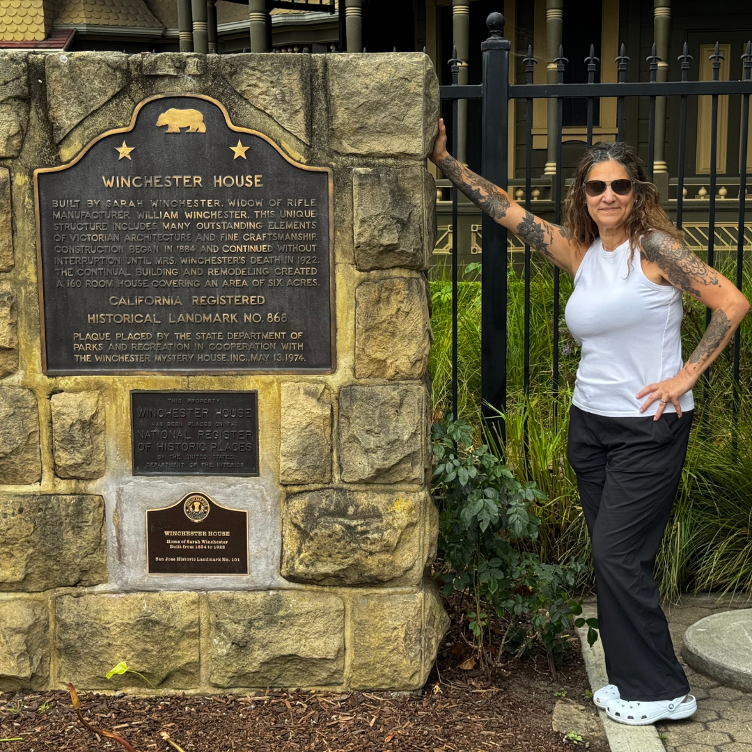 Noel Chapman reading the history plaque at the Winchester Mystery House in San Jose