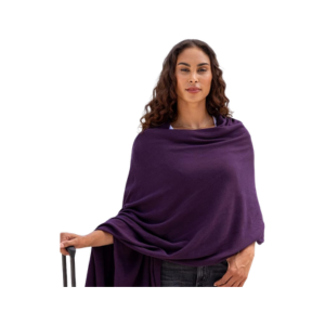 Woman wearing a blackberry organic cotton travel scarf and wrap for flights and cool-weather travel
