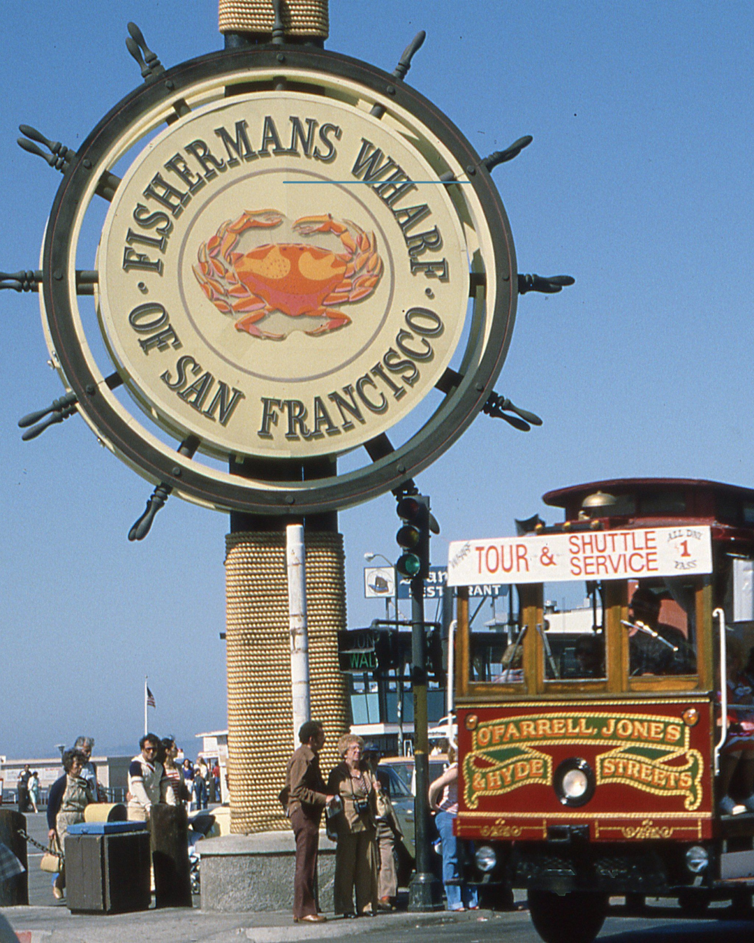 Fisherman's Wharf sign with a cable car in San Francisco.